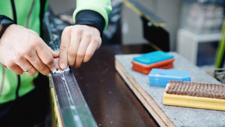 Banner,Ski,Cross-country,Service.,Removing,Excess,Wax,With,Special,Scraper